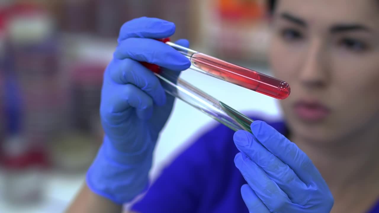 Stock Video Laboratory Worker Looking At A Test Tube Animated Wallpaper - Free Download