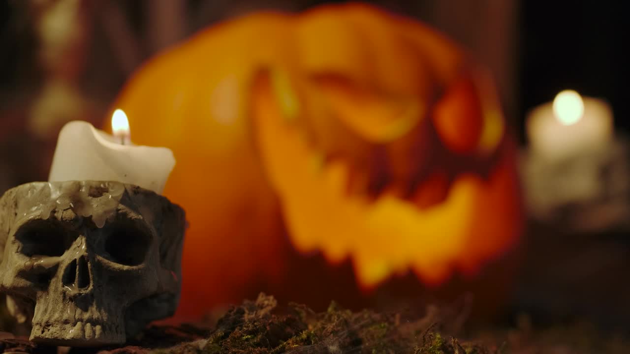 Video Stock Candles On The Sides Of A Lighted Halloween Pumpkin Live Wallpaper For PC - Free Download