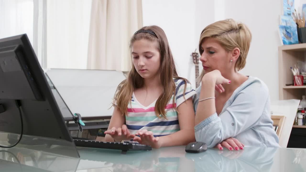Stock Video Mom Helps Daughter With Distance Learning On P Animated Wallpaper - Free Download