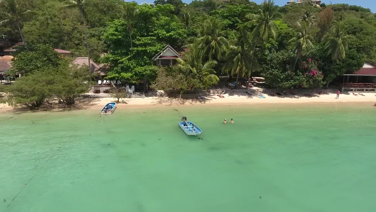 Stock Video Flying Over A Tourist Beach With Bungalows Live Wallpaper For PC - Free Download