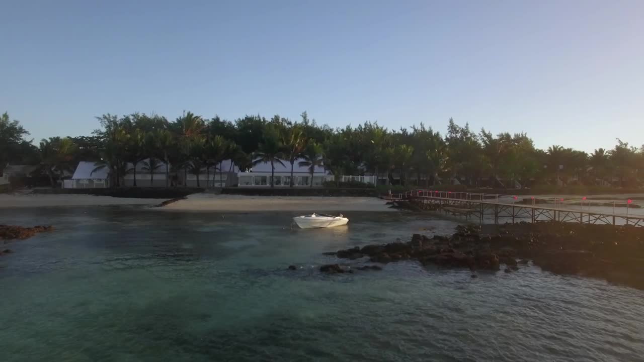 Stock Footage White Boat Anchored By A Small Beach Live Wallpaper - Free Download
