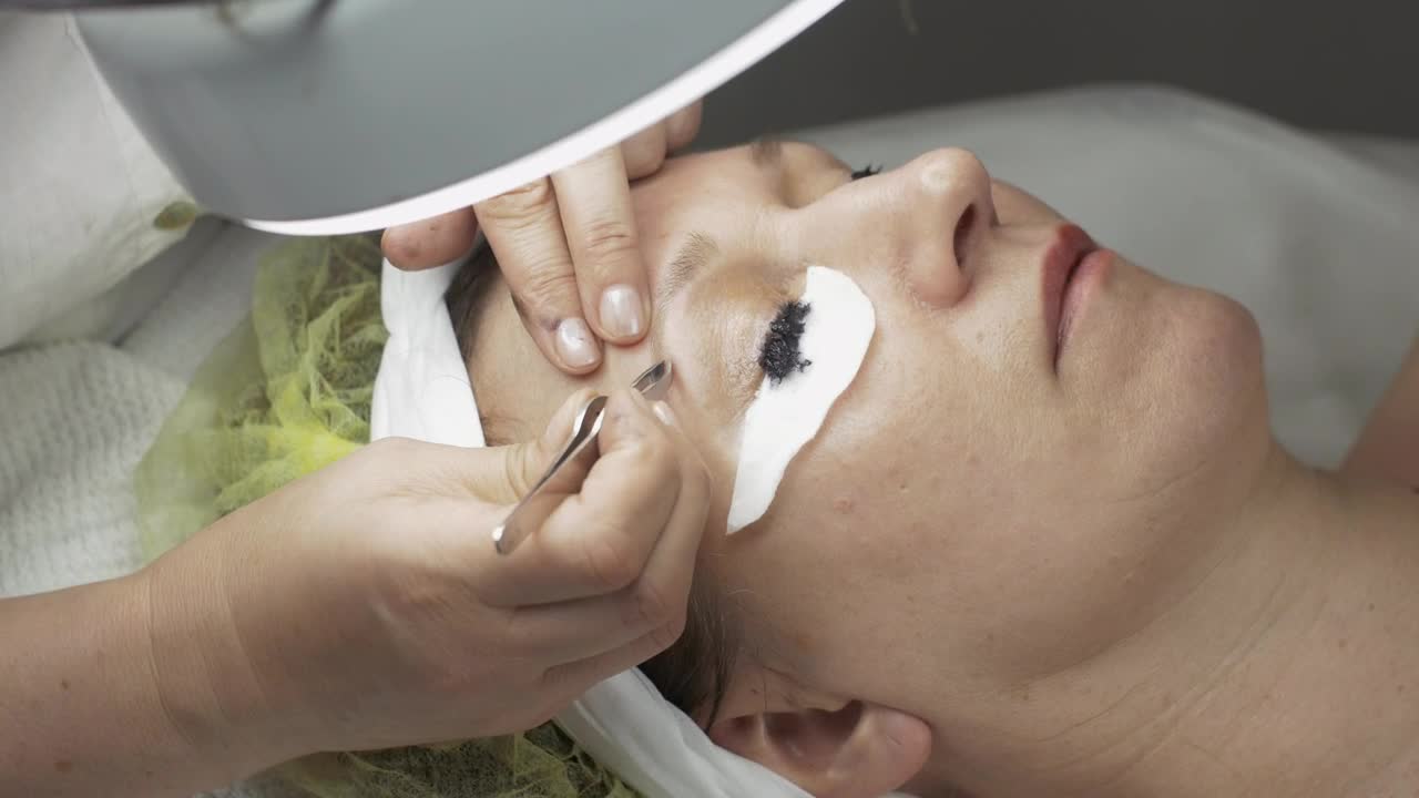 Stock Video Cosmetologist Cleaning An Eyebrow Live Wallpaper For PC - Free Download