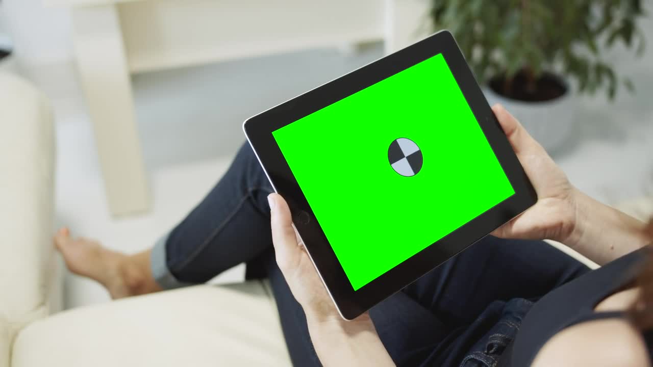 Free Stock Video Sitting On Sofa Browsing Web On Chroma Key Tablet Live Wallpaper - Free Download