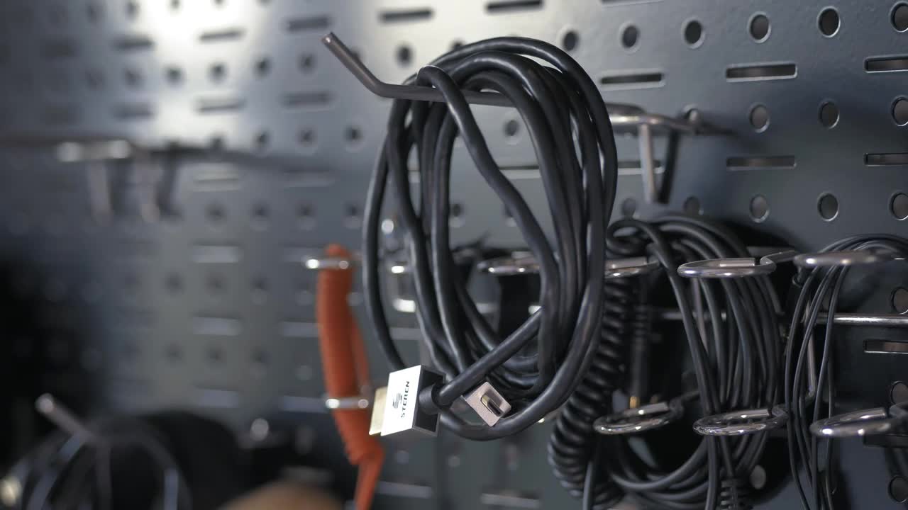 Free Video Stock taking a wire from a tool wall Live Wallpaper - Free Download