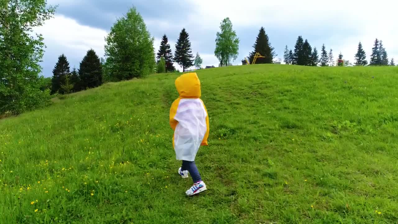 Video Stock Child Taking A Walk In The Grass Wearing A Raincoat Live Wallpaper For PC - Free Download