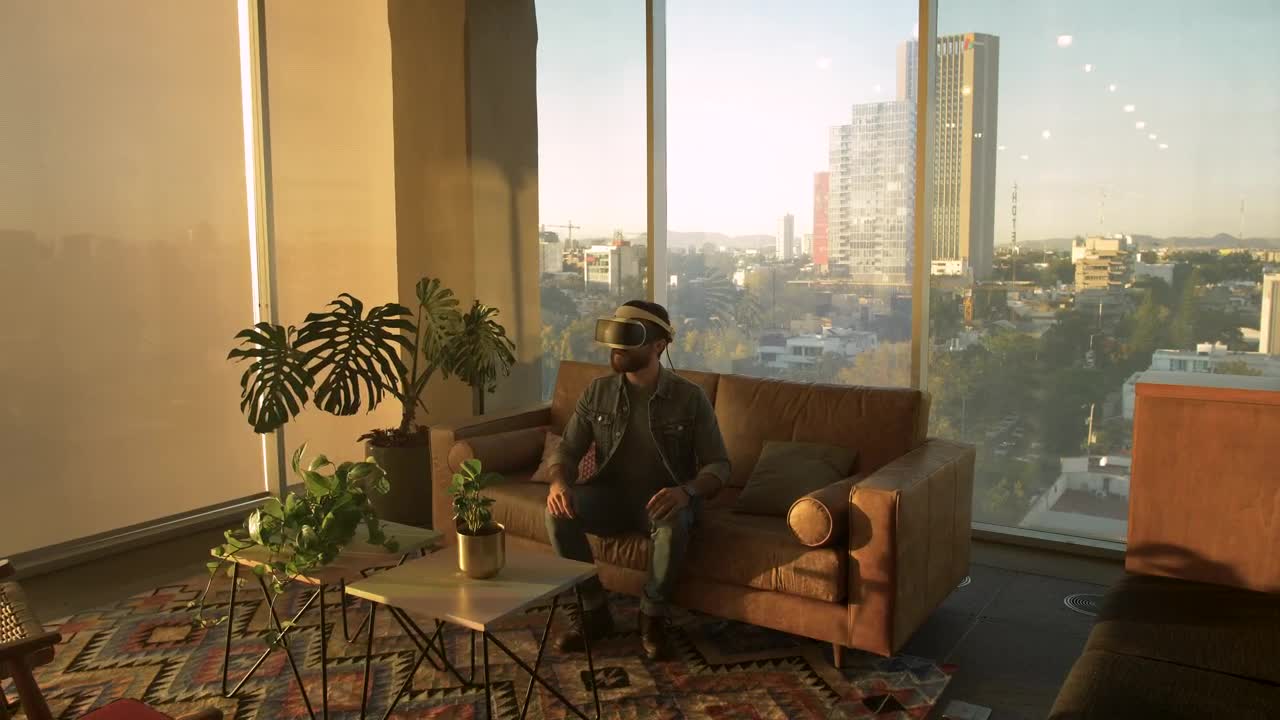 Stock Video Man Wearing Augmented Reality Glasses In An Apartmen Animated Wallpaper - Free Download