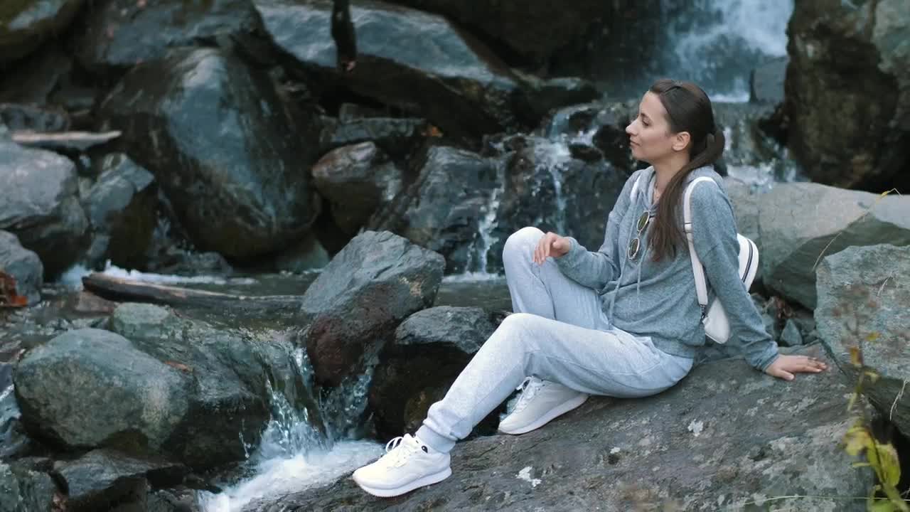 Free Stock Video Woman Relaxing By A Waterfall In A Forest Live Wallpaper - Free Download