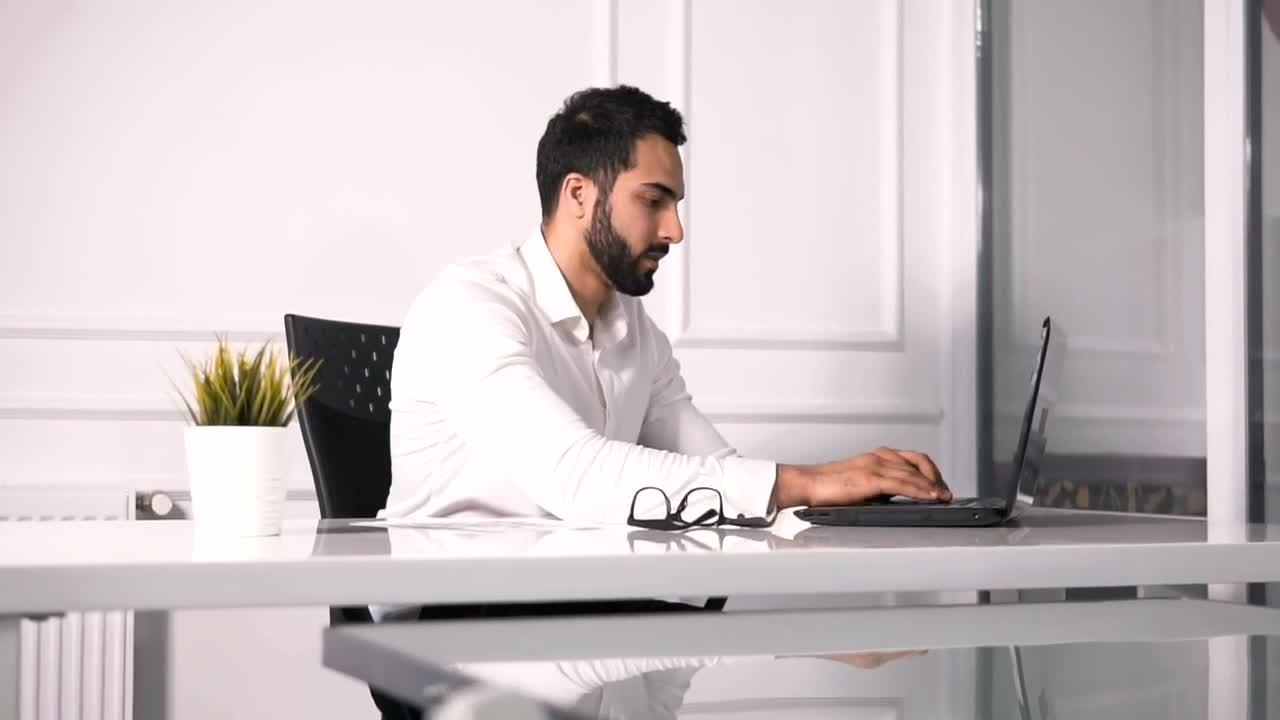 Stock Video Lawyer Working On Laptop Turns And Smiles Animated Wallpaper - Free Download