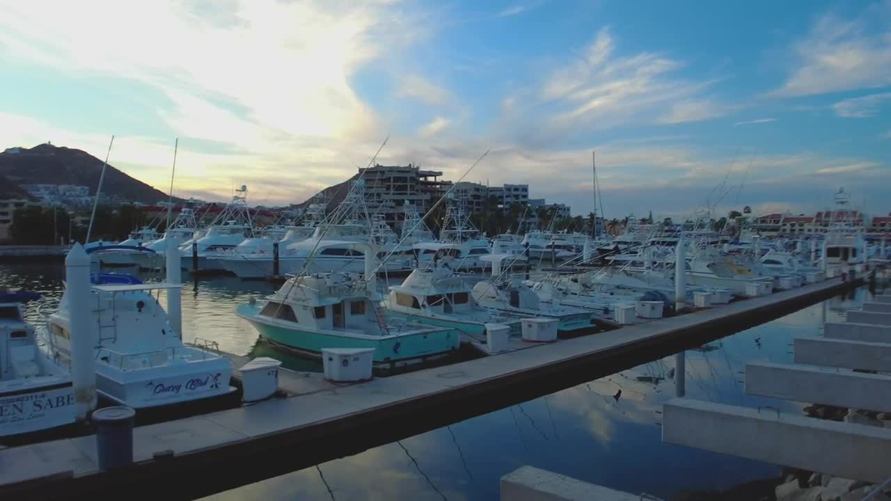 Stock Video Harbor Full Of Boats And Sailboats On A Paradisiacal Coast Animated Wallpaper - Free Download