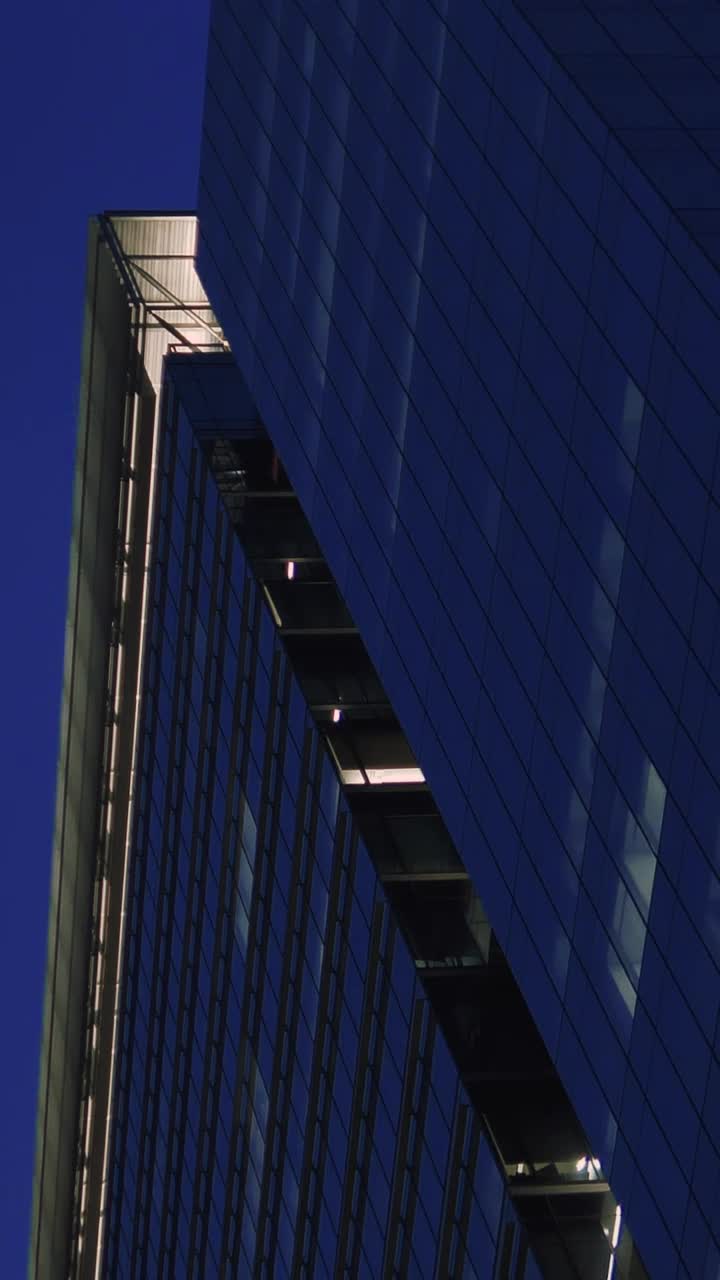Free Video Stock tall building full of windows at dusk Live Wallpaper - Free Download