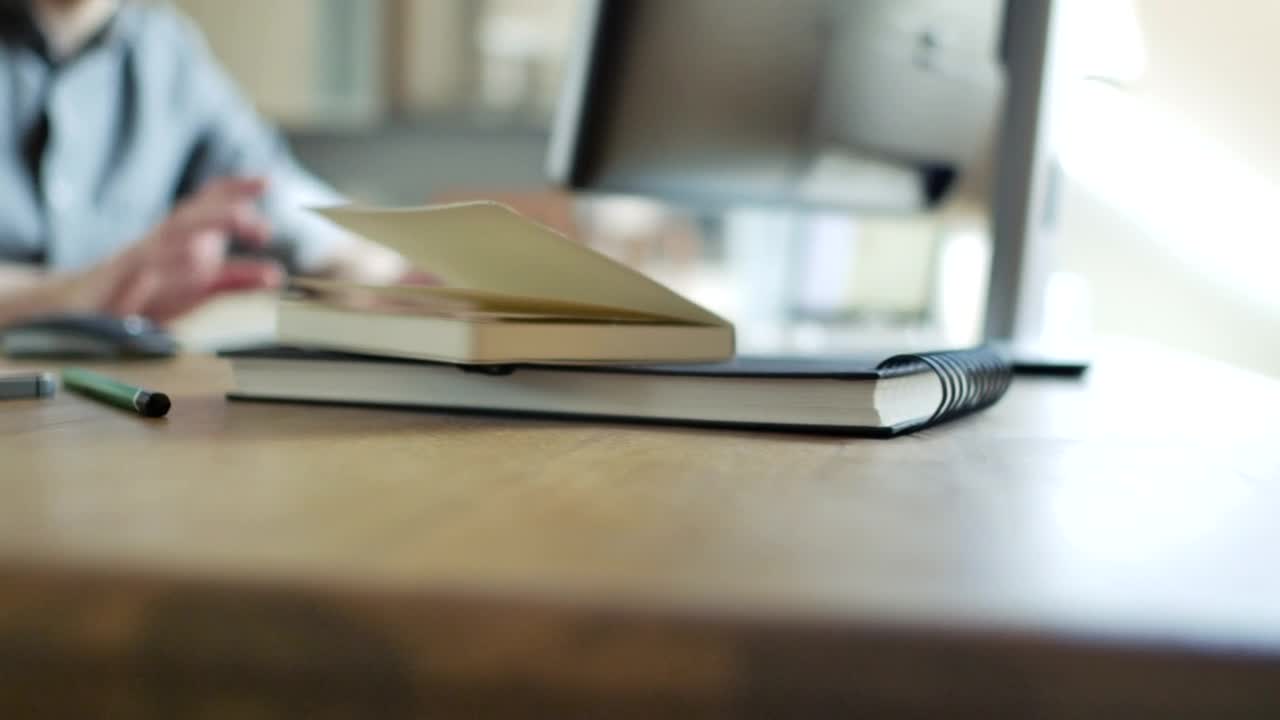 Stock Video Office Objects And A Man Working In The Background Live Wallpaper - Free Download