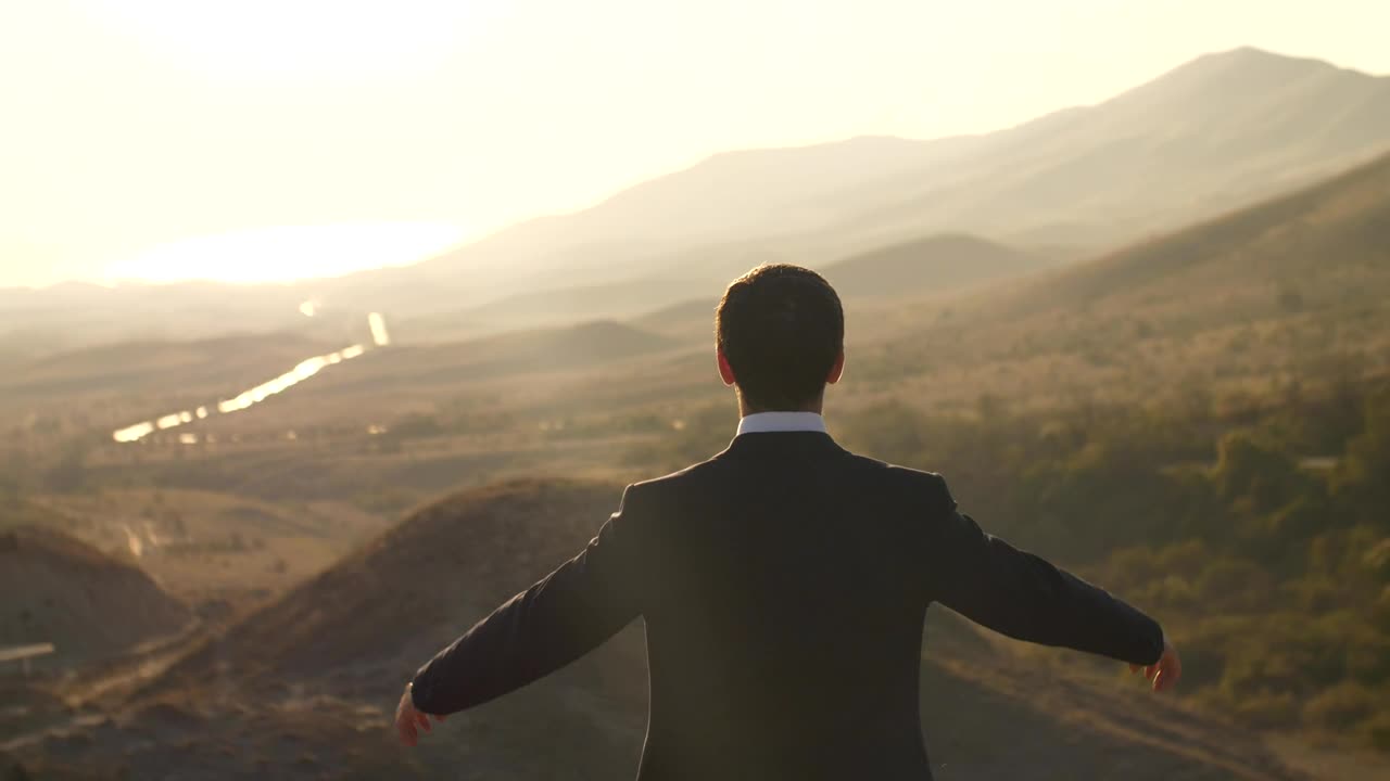 Stock Video Happy Businessman Raises Hands Seen From Behind Animated Wallpaper - Free Download