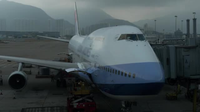 Stock Video Loading Freight Onto A Large Plane Smal Animated Wallpaper - Free Download