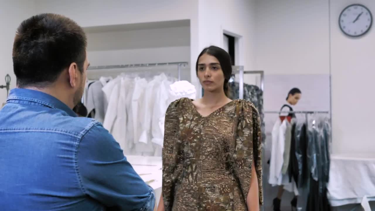 Stock Video Fashion Designer Fits A Brown Dress Live Wallpaper For PC - Free Download