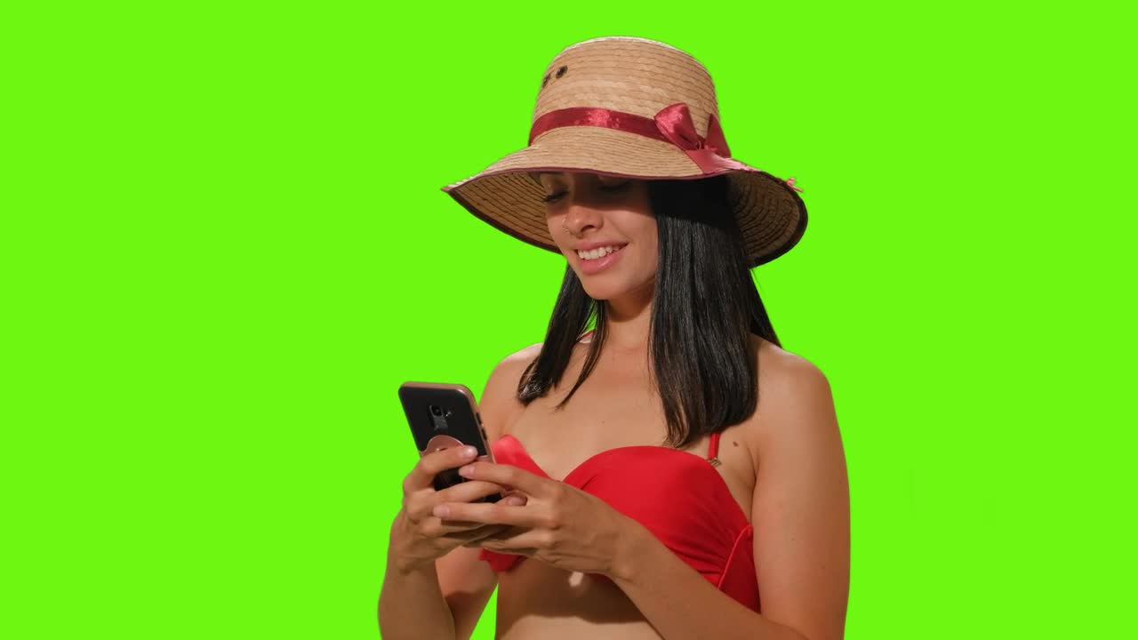 Stock Video Girl In Beachwear Takes A Selfie On Green Screen Live Wallpaper For PC - Free Download