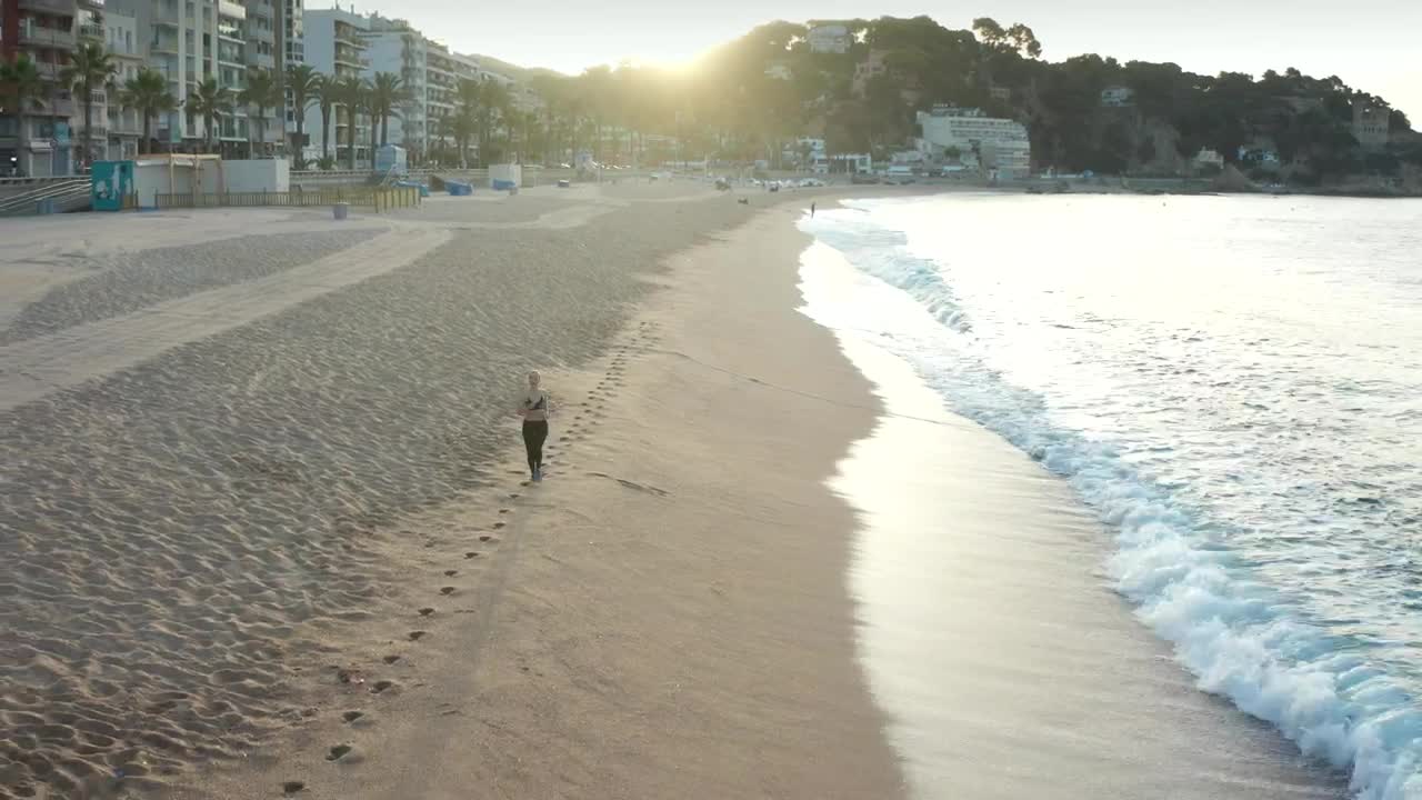 Free Stock Video Woman Running On The Seashore Aerial Shot Live Wallpaper - Free Download