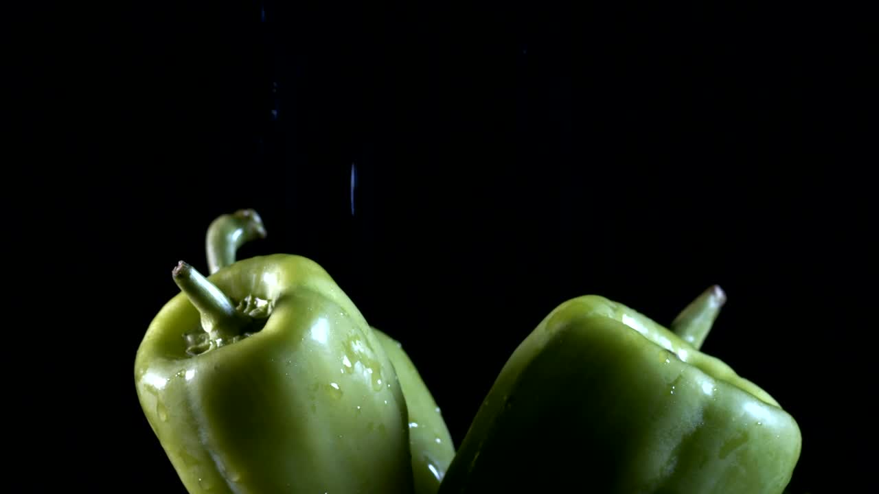 Stock Video Green Chili Peppers Being Wet On Black Background Live Wallpaper For PC - Free Download