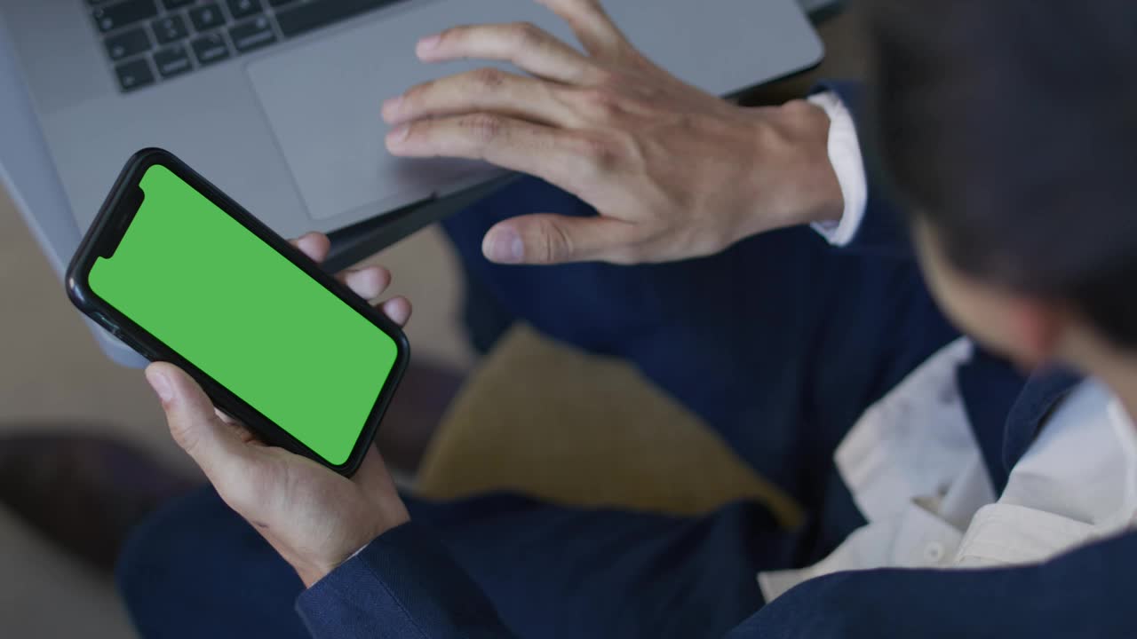 Stock Video Man Using His Computer And Cell Phon Animated Wallpaper - Free Download