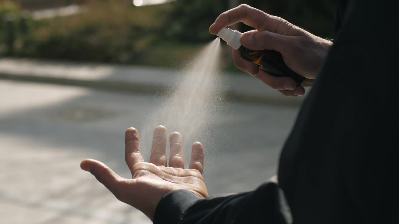 Video Stock Person Sanitizes His Hand With Spray Live Wallpaper Free - Free Download