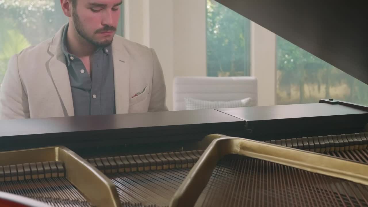 Stock Video Inspired Pianist Playing In An Elegant House Animated Wallpaper - Free Download