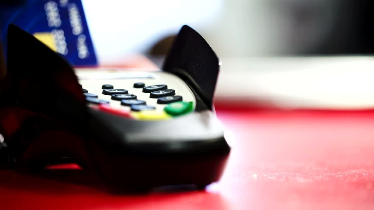 Stock Footage Using A Card Machine At The Counter Live Wallpaper - Free Download