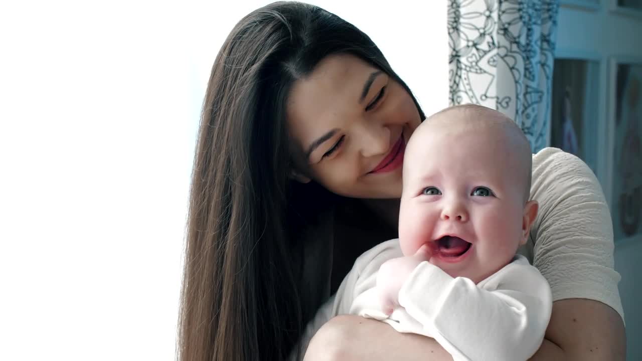 Stock Video Happy Mother Hugging Her Baby Animated Wallpaper - Free Download
