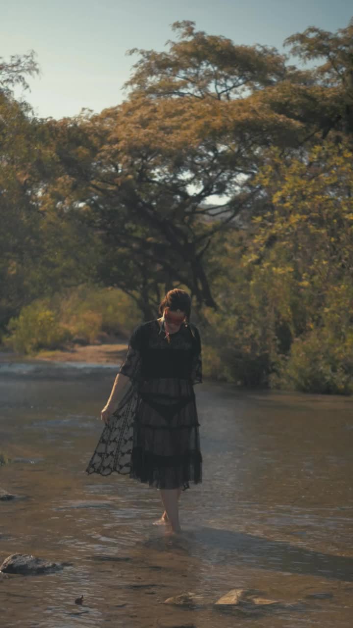 Stock Video Indie Fashion Girl Walking On A River Animated Wallpaper - Free Download
