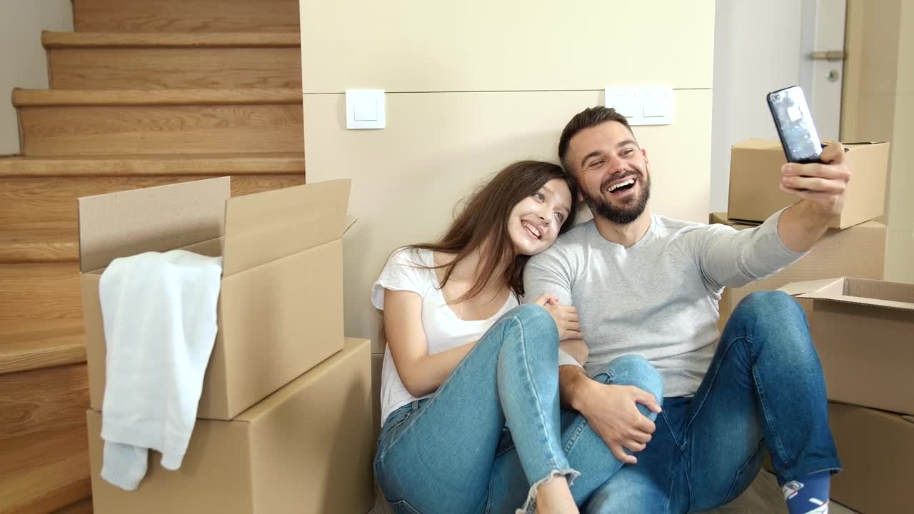 Stock Video Couple In Jeans Take Selfies In New Apartment Live Wallpaper For PC - Free Download
