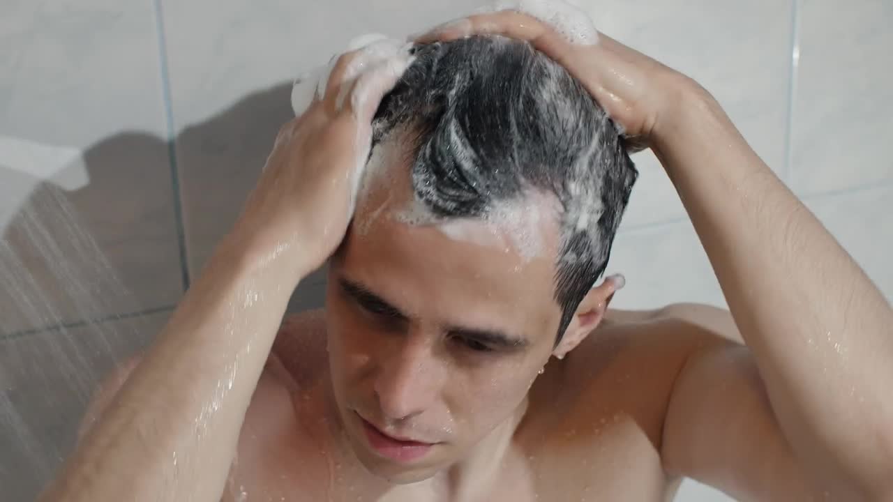 Stock Video Man Washing Hair In Bathroo Animated Wallpaper - Free Download