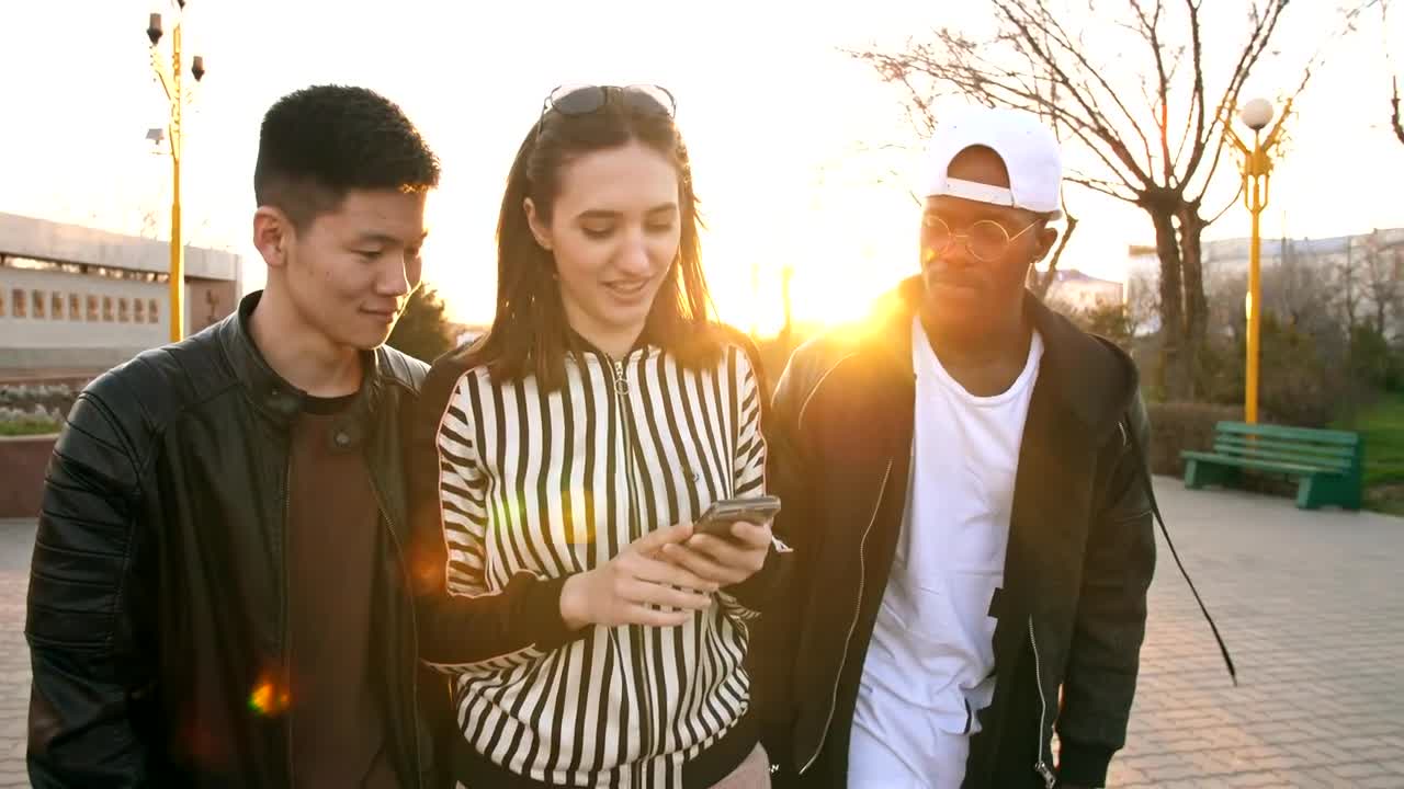 Stock Video Friends Walking Down The Street Watching Social Media Live Wallpaper For PC - Free Download