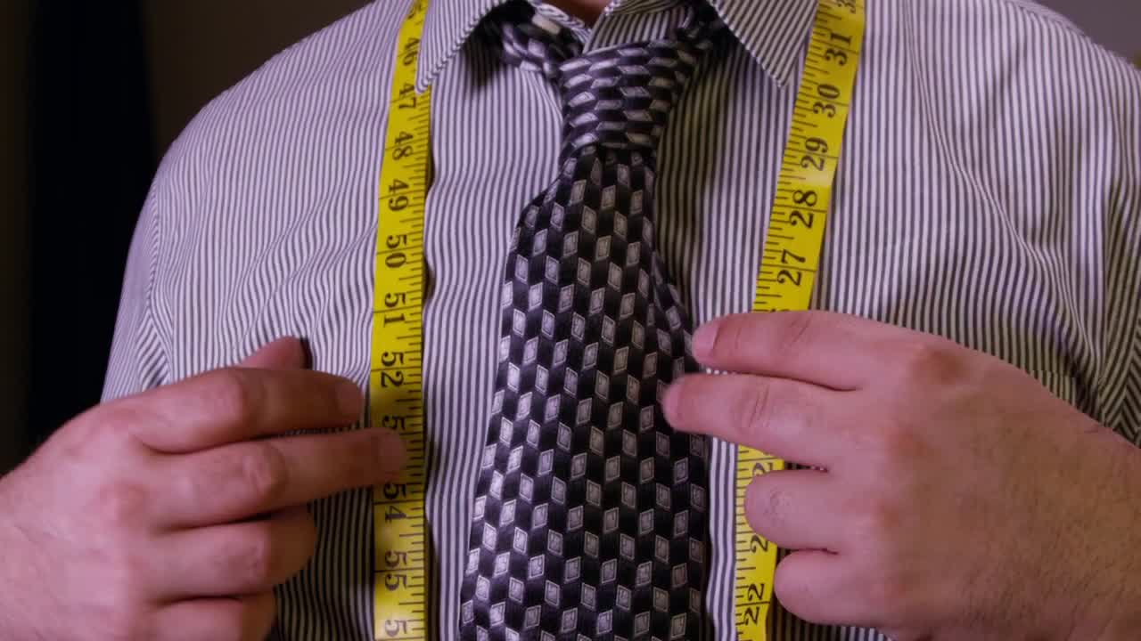 Free Video Stock tailor tying up a measuring tape Live Wallpaper - Free Download
