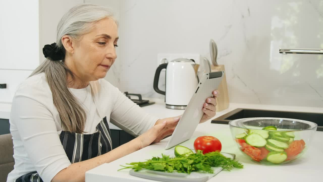 Stock Video Old Woman Searching For Healthy Recipes Live Wallpaper - Free Download