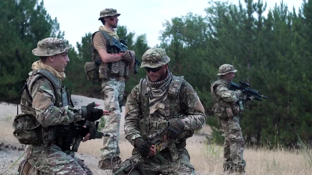 Free Video Stock Soldiers Checking The Strategy On The Map Live Wallpaper - Free Download