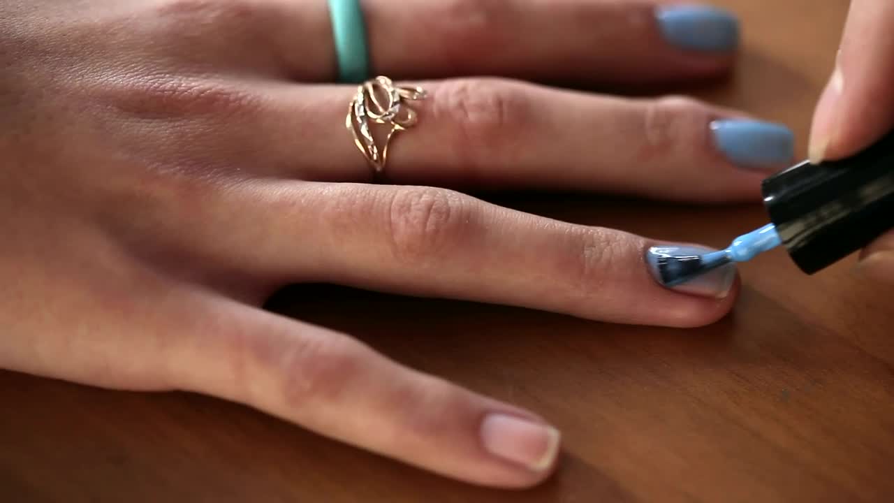 Stock Video Painting Blue Nails On Woman Hand Live Wallpaper - Free Download