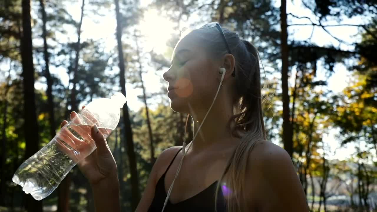 Stock Video Fitness Woman Drinking Water During Her Training Live Wallpaper For PC - Free Download