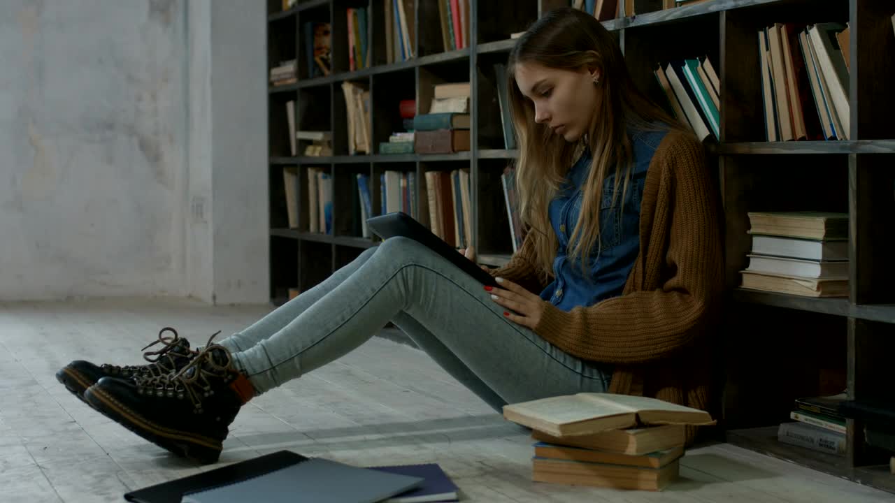 Stock Video Girl Working On The Floor Of A Library Live Wallpaper For PC - Free Download