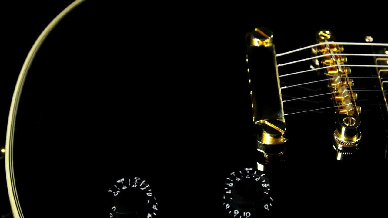 Stock Video Black Guitar With Golden Strings Live Wallpaper For PC - Free Download