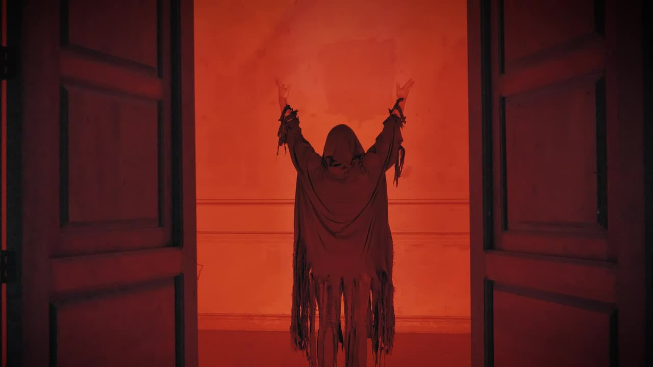Free Video Stock Sneaky Robed Person With Arms Up Under A Red Light Live Wallpaper - Free Download