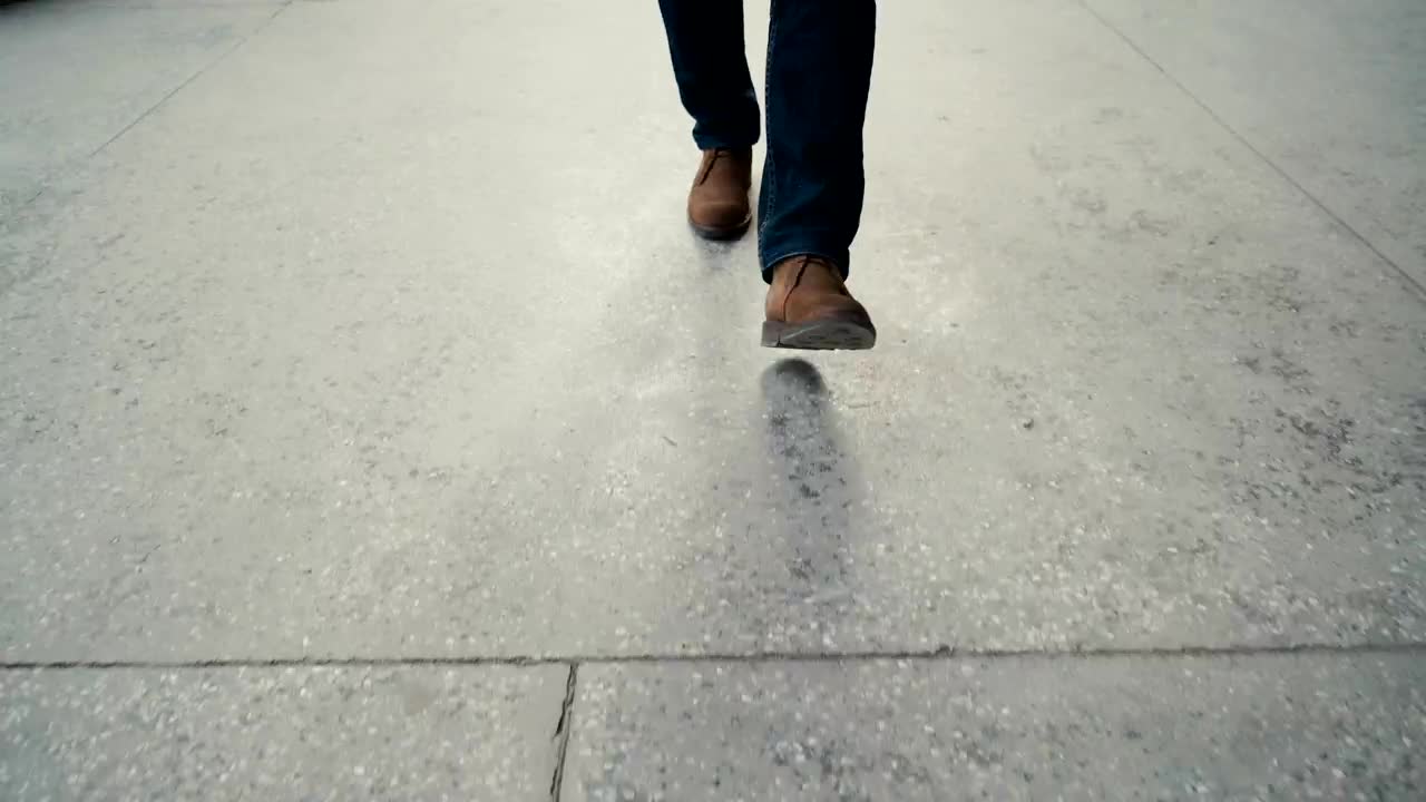 Stock Video Legs Of A Man Walking On The Street Animated Wallpaper - Free Download