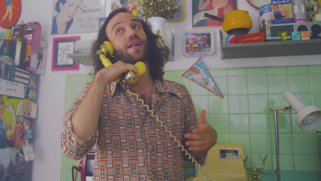 Stock Video Man Talking Cheerfully On An Old Telephon Animated Wallpaper - Free Download