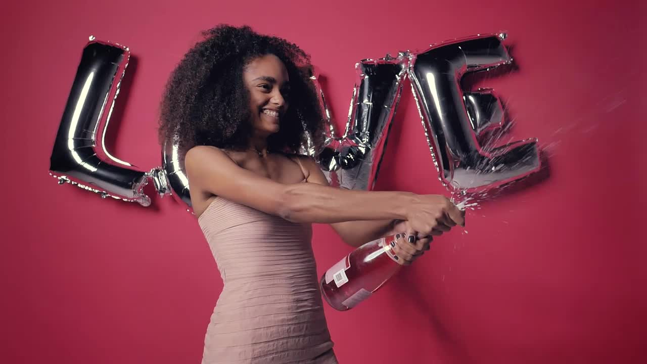 Stock Video Excited Woman With A Frothy Bottle Of Cider On Valentines Live Wallpaper For PC - Free Download