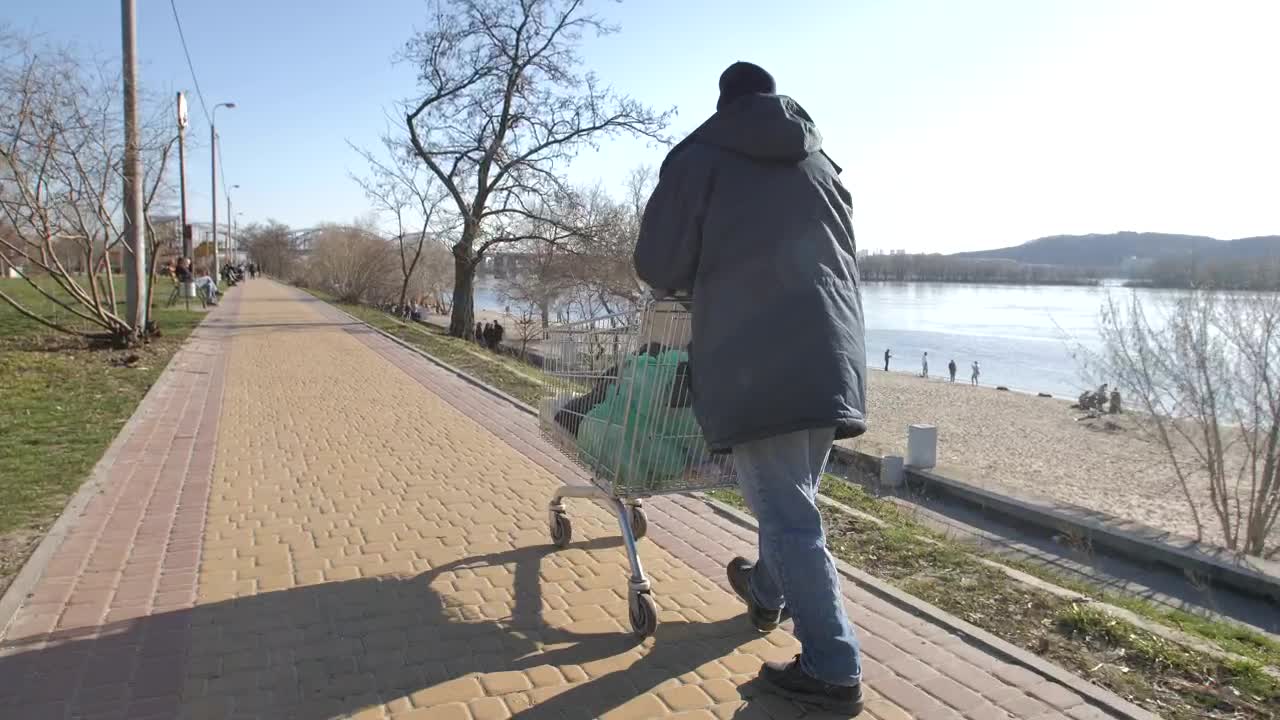 Stock Video Homeless Man Walking By The Lake Animated Wallpaper - Free Download