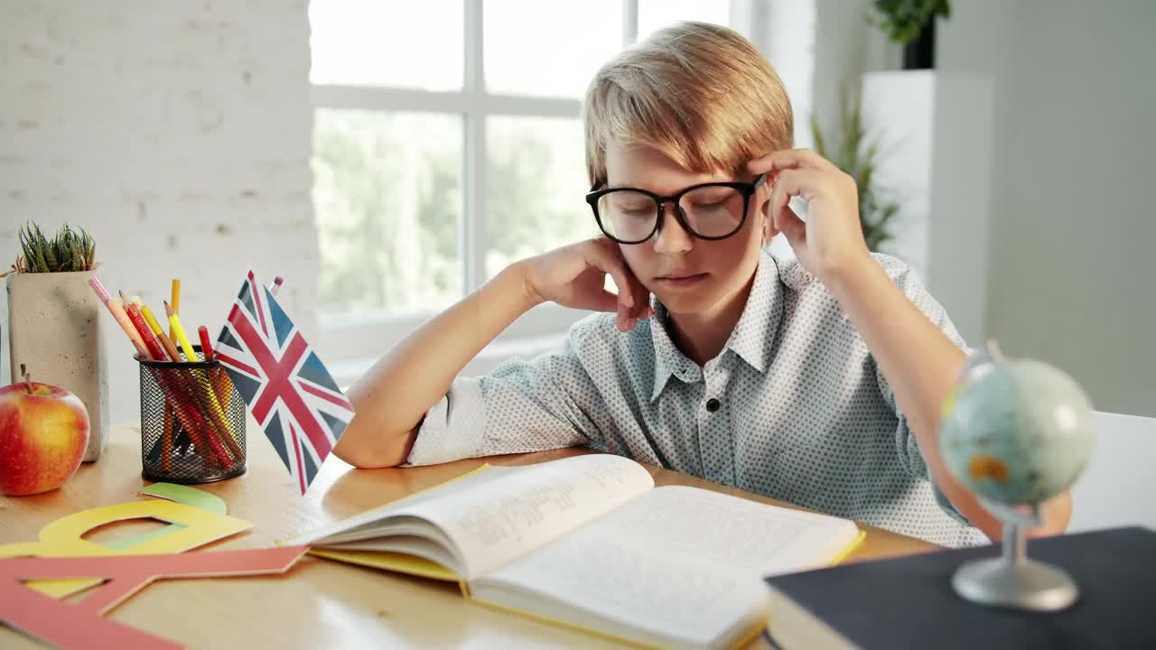 Free Video Stock tired boy studying at home Live Wallpaper - Free Download