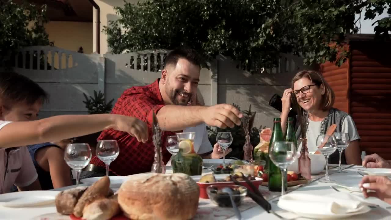 Stock Video Family Having A Fancy Dinner Outdoors Live Wallpaper For PC - Free Download