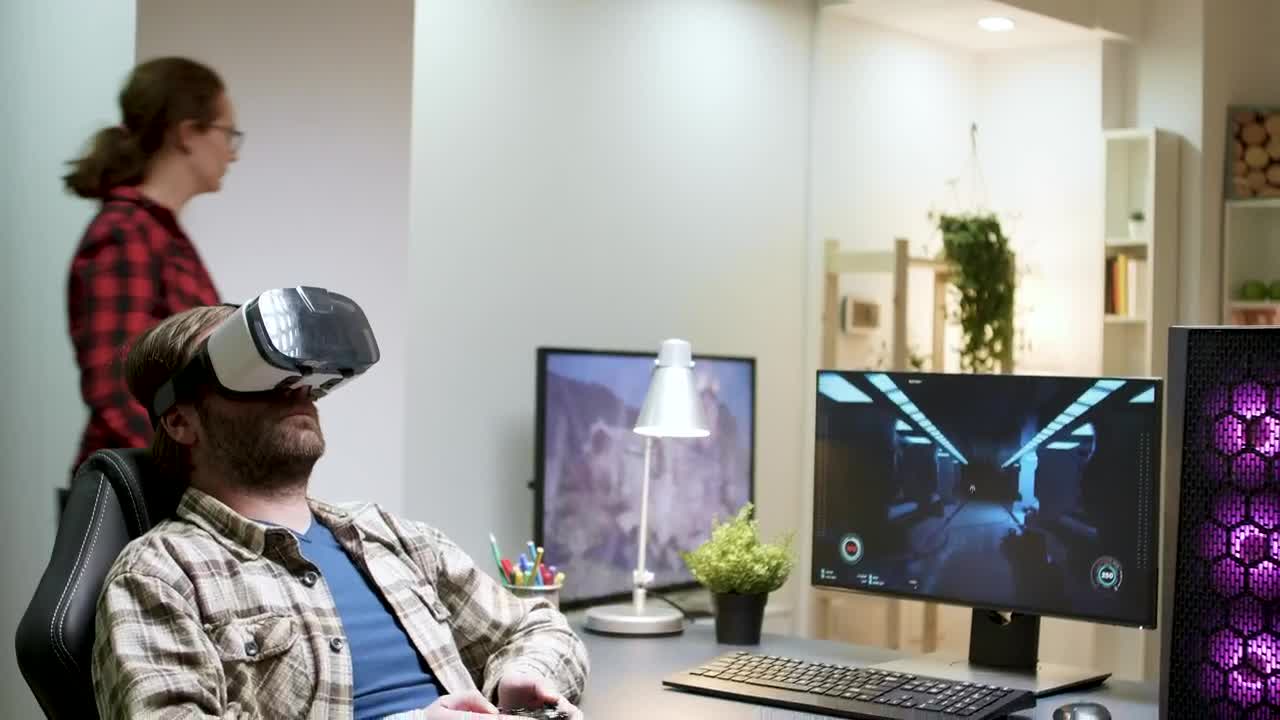 Stock Video Man Enjoys Virtual Gaming In Home Office Animated Wallpaper - Free Download