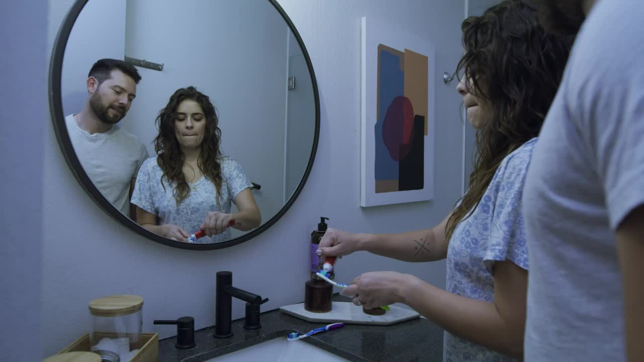 Stock Video Couple Brushing Their Teeth Together In A Bathroom Live Wallpaper For PC - Free Download