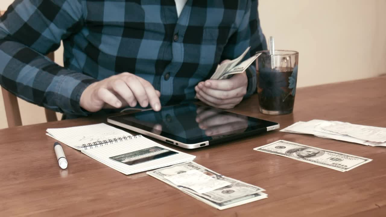 Stock Video Man Separating Money For Different Budget Animated Wallpaper - Free Download