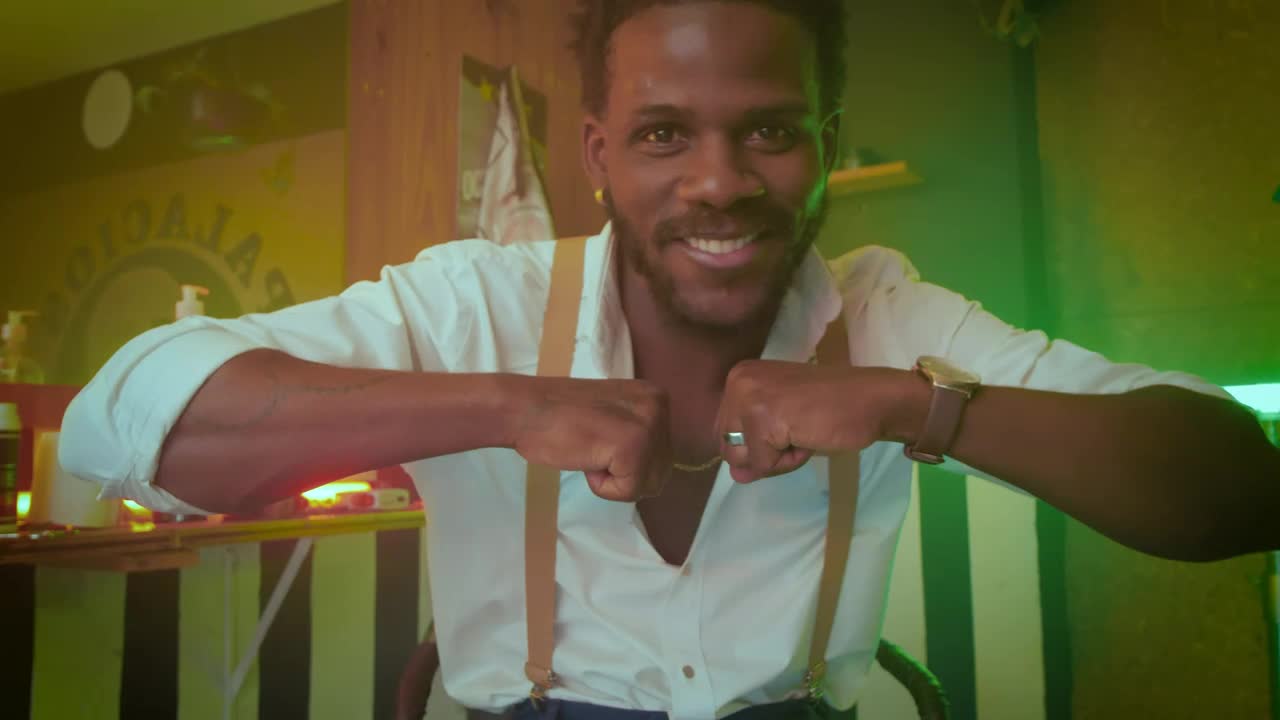 Free Video Stock Stylish Man Dancing In Front Of The Camera In A Live Wallpaper - Free Download