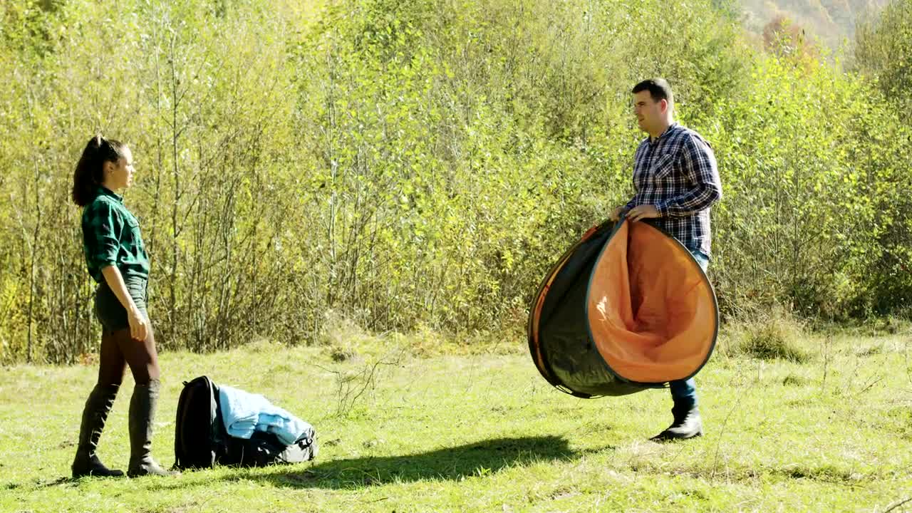 Stock Video Couple Preparing A Tent For The Night Live Wallpaper For PC - Free Download