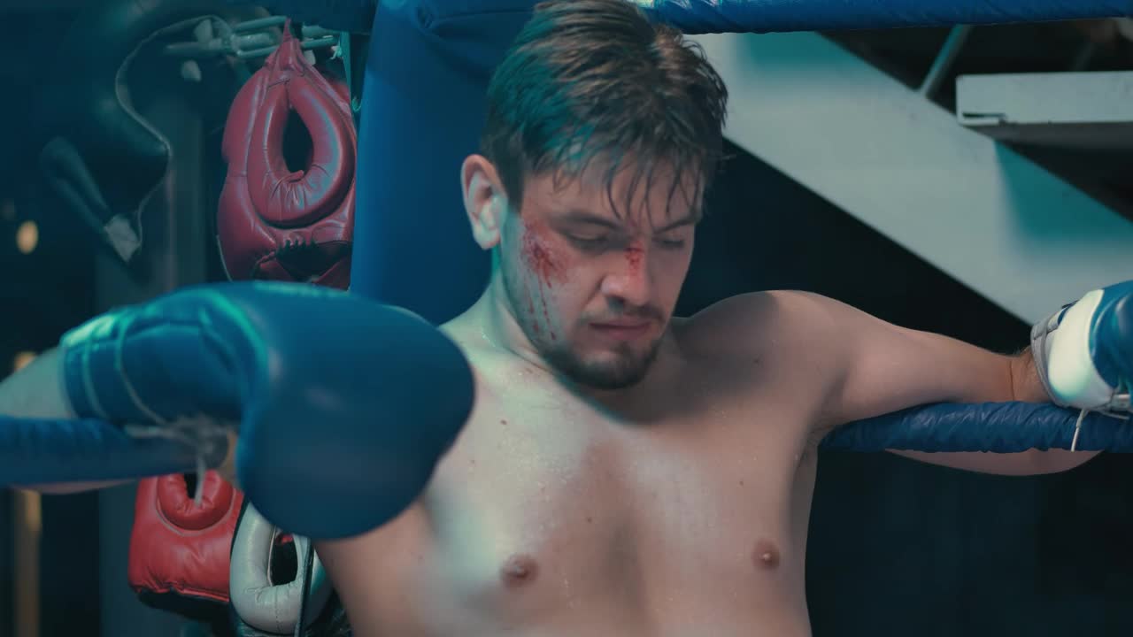Stock Video Injured Boxer Sitting In The Ring Animated Wallpaper - Free Download